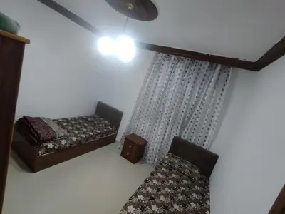 a room with a bed and a chair in it at الشهم 10 in Irbid