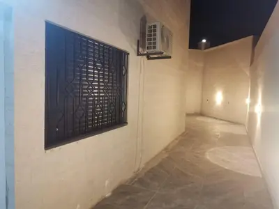 an empty hallway with a window in a building at 2 Master Bedroom Deluxe Apartment Queen Alia Airport Families Women ONLY in Amman