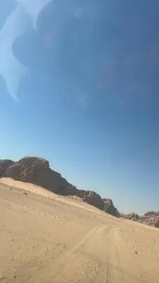 a dirt road in the middle of the desert at Lamis Camp Wadi Rum in Aqaba