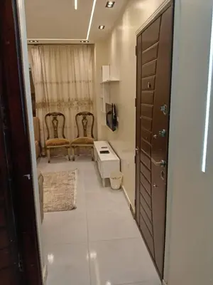 a bathroom with two chairs and a table in a room at Samara inn in Aqaba