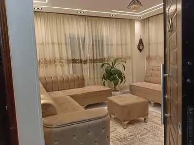 a living room with couches and a couch and a table at Samara inn in Aqaba