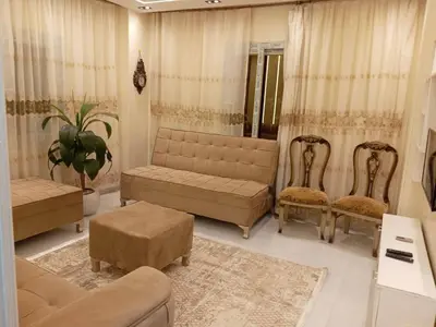a living room with a couch and chairs and a table at Samara inn in Aqaba