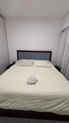 a bed with a white hat on top of it at العقبة in Aqaba