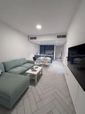 a living room with a couch and a table at العقبة in Aqaba