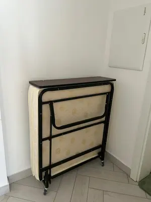 a dresser in the corner of a room at One bedroom at ayla azure in Aqaba
