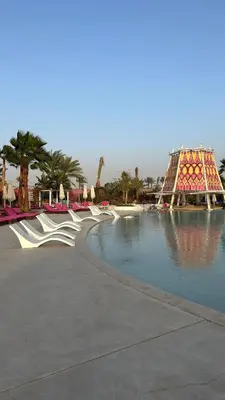 a swimming pool in a resort with a roller coaster at One bedroom at ayla azure in Aqaba