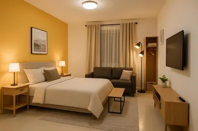 a hotel room with a bed and a couch at Stay with Obada Private Room in Amman
