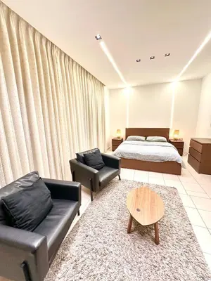a living room with a bed and a couch at Abdoun Modern Apartment Near US Embassy in Amman