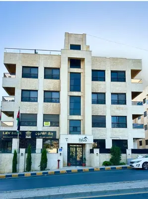 a building with a car parked in front of it at Abdoun Modern Apartment Near US Embassy in Amman