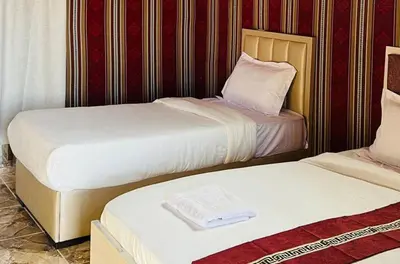 two beds sitting next to each other in a room at ATAYA sunrise camp in Disah