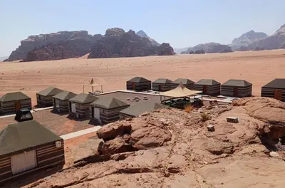 a group of huts in the middle of the desert at ATAYA sunrise camp in Disah