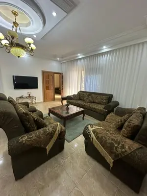 a living room with couches and a coffee table at 3 Bedroom Family Apartment in Amman in Amman