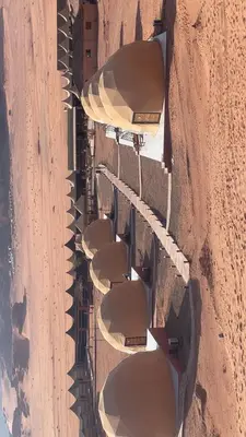 an overhead view of a row of buildings on a road at Desert Horizon Camp in Disah