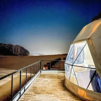 a boat sitting on a boardwalk near the beach at Wadi rum sami camp in Wadi Rum