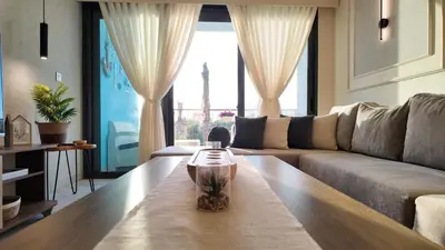 a living room with a couch and a table at واحة ايلة ازور in Aqaba