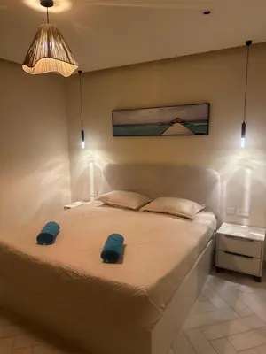 a bedroom with a large bed with lights on it at واحة ايلة ازور in Aqaba