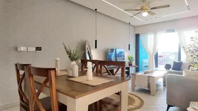 a dining room and living room with a table and chairs at شقه للإيجار في ايله للعائلات in Aqaba