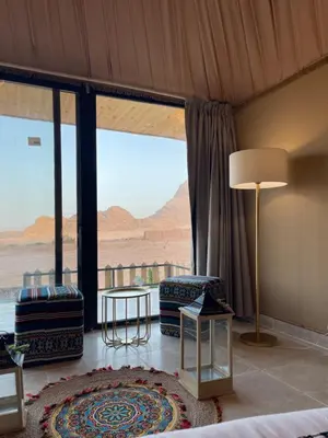 a room with a large window with a view of the desert at Spirit of the Badia camp in Disah