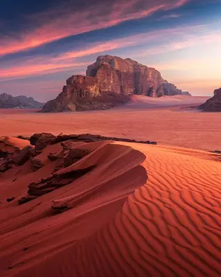 a desert with a large mountain in the background at Spirit of the Badia camp in Disah