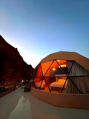 a tent that is sitting on the side of a road at millennium camp in Wadi Rum