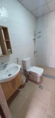 a bathroom with a toilet and a sink at Wadi Rum Aura Camp in Wadi Rum
