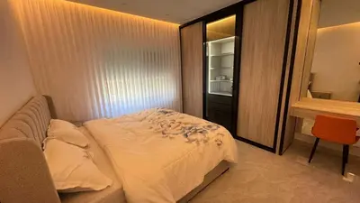 a small bedroom with a bed and a desk at Luxury 3 Bedroom Family Apartment in Amman in Amman