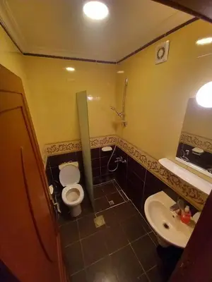 a small bathroom with a toilet and a sink at فندق برستيج العقبه Prestig in Aqaba