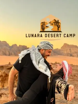 a man and a woman standing in the desert at Lunara Desert Luxury Camp in Wadi Rum