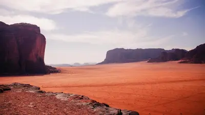 a view of the desert with mountains in the background at Wadi Rum Sands Story Camp &Tours in Wadi Rum