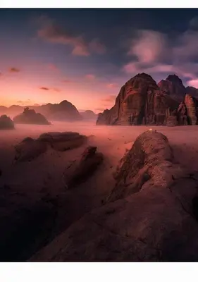 a view of a desert with rocks and mountains at Wadi rum tenda camp in Wadi Rum