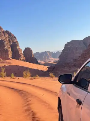 a car parked on a dirt road in the desert at The Celestial Dome in Disah