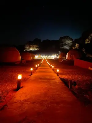 a row of candles on a road at night at Nomads Heaven in Disah