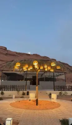 a group of lights on a pole in front of a building at NOVA lUXURY CAMP in Wadi Rum