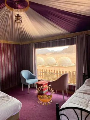 a hotel room with a view of a balcony at Seven Pillars Luxury Camp in Wadi Rum