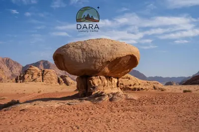 a rock in the middle of the desert at DARA RUM lUXURY CAMP in Wadi Rum