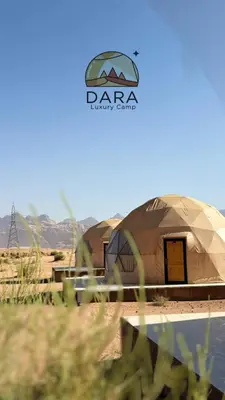 a yurt in the desert with a sign on it at DARA RUM lUXURY CAMP in Wadi Rum
