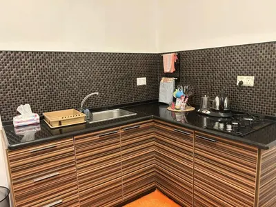 a kitchen with a sink and a counter top at Abdallah Wa'el Adham in Aqaba