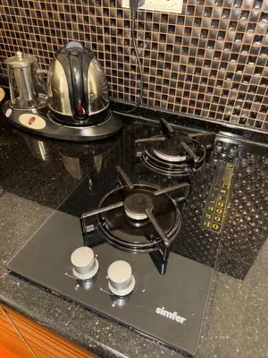 a tea pot sitting on top of a stove in a kitchen at Abdallah Wa'el Adham in Aqaba