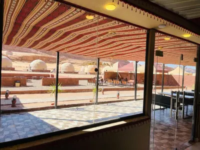 a view of a patio from the window of a restaurant at Rum Desert Silence Camp in Wadi Rum