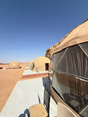 a view of an rv in the desert at NAJMA lUXURY CAMP in Wadi Rum
