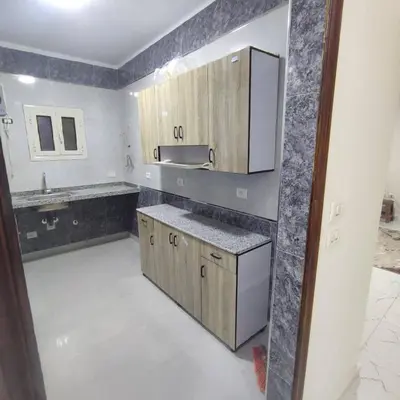 a kitchen with a sink and a counter top at Abu yousef chalet in Irbid