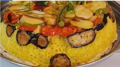 a plate of food with noodles and meat and vegetables at Petra House for Traditional Jordanian Food in Petra