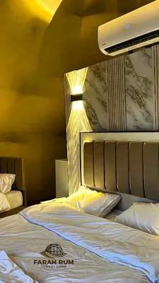 a hotel room with a bed with avisorvisor at FARAH RUM LUXURY CAMP & Bubbles Hotel in Wadi Rum