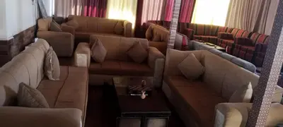 a living room with two couches and a table at Petra sharing room in Petra