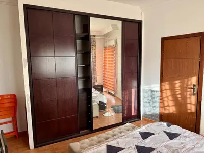 a bedroom with a bed and a large mirror at Fully Furnished apartment for rent in Amman Khalda in Amman