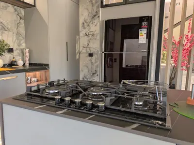 a kitchen with a stove top oven in a kitchen at Noorhan Private Luxury Layover Villa - 10 Minutes to Airport in Amman