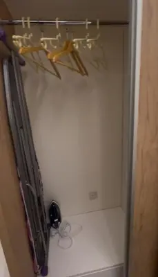 a room with a shelf with some items on the wall at السلام للشقق الفندقية peace hotel apartments in Aqaba