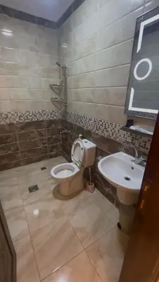 a bathroom with a toilet and a sink at السلام للشقق الفندقية peace hotel apartments in Aqaba