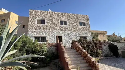 a stone house with stairs leading up to it at Peace House in Wadi Musa