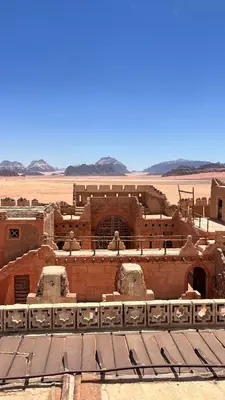 an ancient building in the middle of the desert at Wadi Rum Sila Camp in Wadi Rum